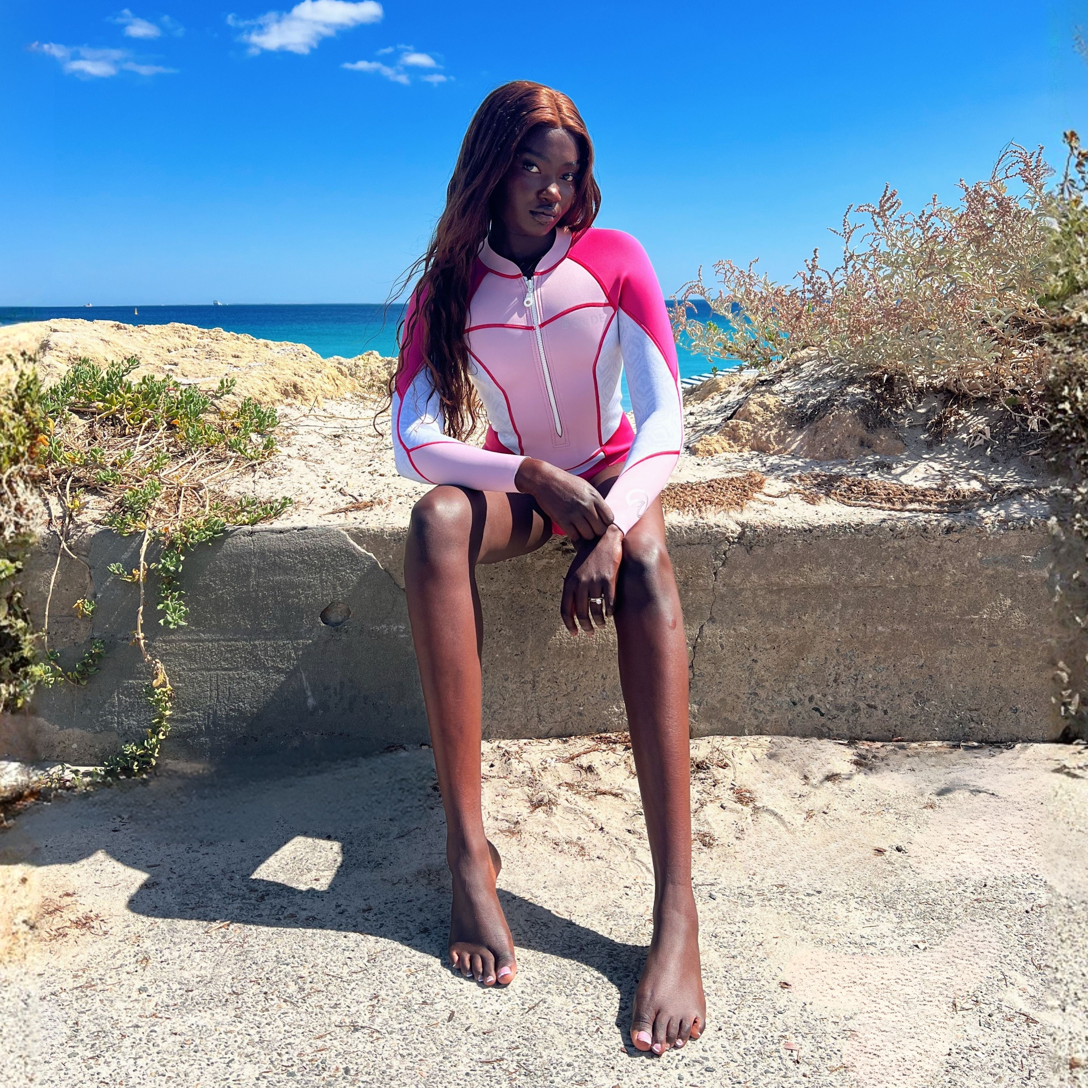 A model wearing a BOLDE Turtle women's spring suit in pink colour