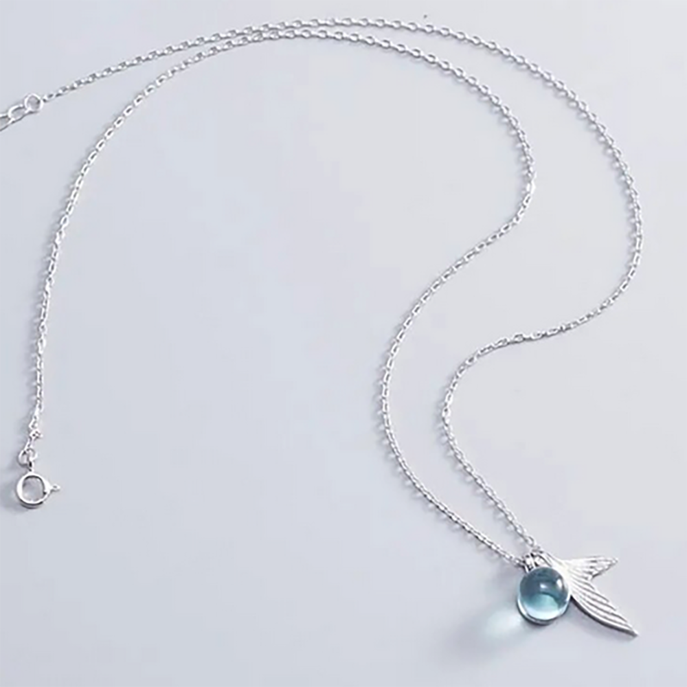 marine jewellery whale tail necklace with crystal blue drop